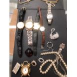A COLLECTION OF WATCHES AND JEWELLERY.