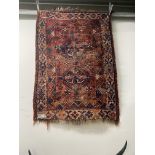 AN ANTIQUE PERSIAN SHIRAZ RUG