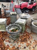 THREE CONCRETE PEDESTALS AND FOUR GARDEN PLANTERS