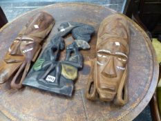 TWO MOTHER OF PEARL INLAID TRIBAL MASKS TOGETHER WITH AN AFRICAN PANEL OF A COUPLE BELOW A TREE