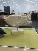 TWO LARGE CARVED FISH FIGURES.