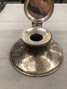 A HALLMARKED SILVER CAPSTAN INKWELL.