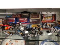 A COLLECTION OF VARIOUS MODEL MOTORCYCLES, BUSES ETC.