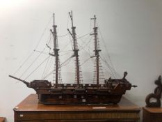 A NAIVE SCRATCH BUILT MODEL OF A LARGE SAILING SHIP.