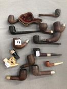 A CARVED MEERSCHAUM PIPE IN CASE AND VARIOUS BRIAR PIPE BOWLS.