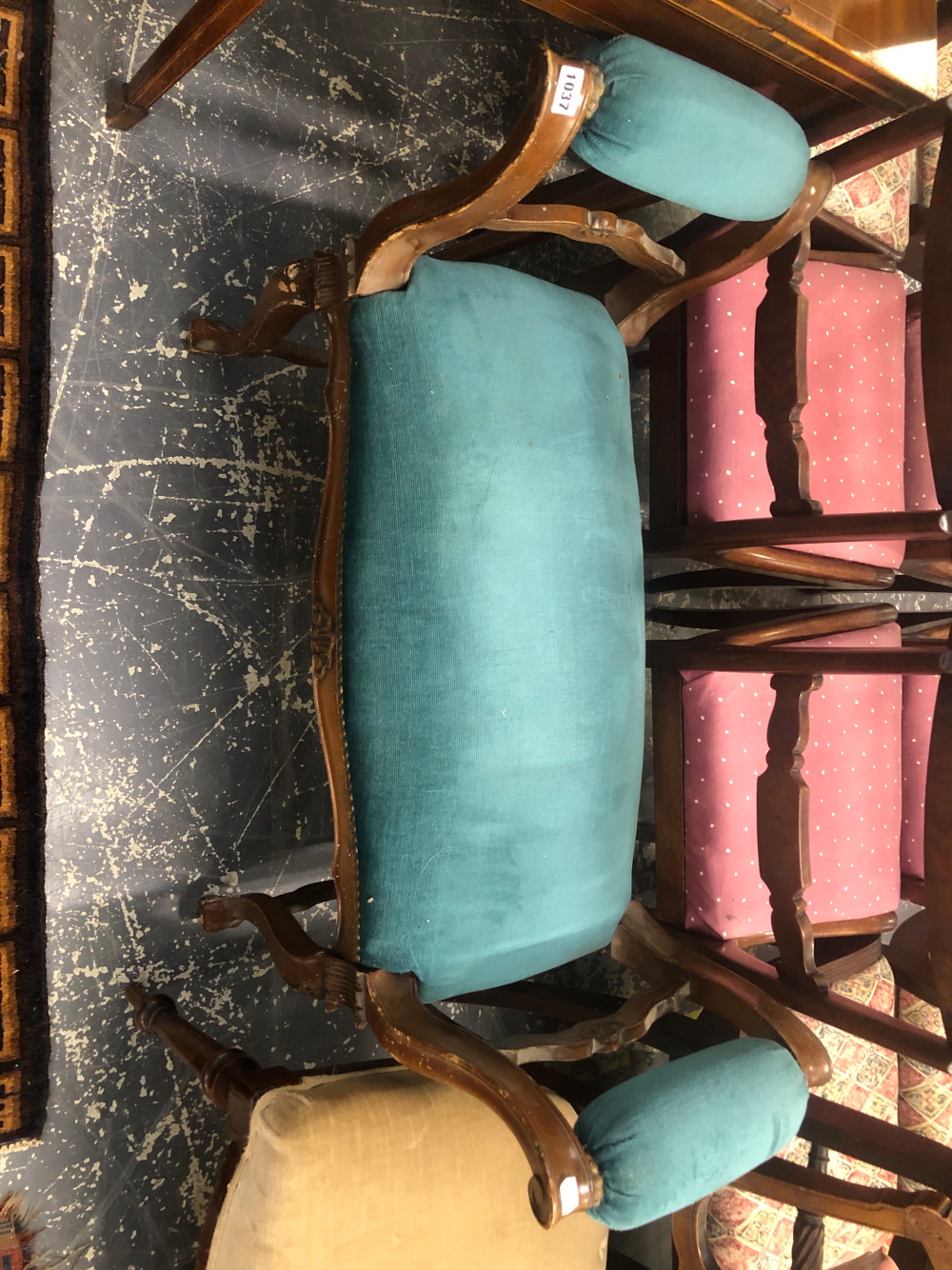 A MAHOGANY WINDOW SEAT WITH THE ARM TOPS AND SEAT UPHOLSTERED IN BLUE VELVET ABOVE THE CABRIOLE