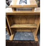 A VICTORIAN PINE LECTERN, THE BOOK REST ABOVE A SHELF AND THE ENCLOSED FRONT ON PLANK FEET. W 103