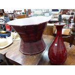 AN EASTERN RED LACQUER POLYGONAL DRUM TABLE. W 64 x D 64 x H 48cms. TOGETHER WITH A SIMILAR BLACK