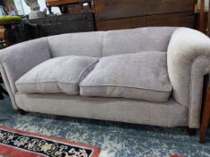 A TWO SEAT SETTEE UPHOLSTERED IN PALE MAUVE