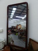 A MAHOGANY FRAMED MIRROR. 127 x 66cms. TOGETHER WITH A MAHOGANY CROSS BANDED OAK BOW FRONT CORNER