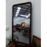 A MAHOGANY FRAMED MIRROR. 127 x 66cms. TOGETHER WITH A MAHOGANY CROSS BANDED OAK BOW FRONT CORNER