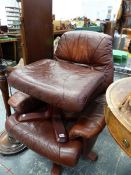 A 20th C. BROWN LEATHERETTE ARMCHAIR ROTATING ON FOUR PLYWOOD LEGS TOGETHER WITH A FOOT STOOL EN