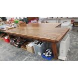 A CLEATED OAK PLANK TOP REFECTORY TABLE WITH A DRAWER TO ONE SIDE ABOVE THE TAPERING SQUARE LEGS.