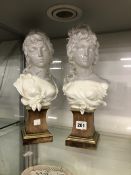 A PAIR OF PORCELAIN ROYAL WORCESTER BUSTS ON MAHOGANY PLINTHS.