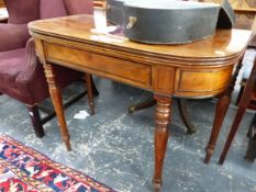 A GEORGE III MAHOGANY TEA TABLE, THE ROUNDED RECTANGULAR TOP OVER AN EBONY EDGED DRAWER, BALUSTER