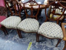 A SET OF THREE LATE VICTORIAN MAHOGANY SHIELD BACKED CHAIRS, THE FOUR BAR BACK SPLATS CENTRED BY