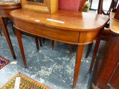 A 19th C. MAHOGANY DEMILUNE TABLE, THE TAPERING SQUARE LEGS ON CASTER FEET. W 87 x D 46 x H 69cms.