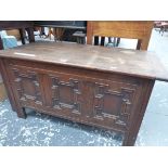 A 20th C. OAK COFFER WITH FOUR PANELLED FRONT. W 91 x D 45 x H 72cms.