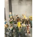 ELEVEN ROYAL WORCESTER DAYS OF THE WEEK CHILDREN FIGURINES TOGETHER WITH A FLOWER FAIRY DECORATED