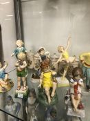 ELEVEN ROYAL WORCESTER DAYS OF THE WEEK CHILDREN FIGURINES TOGETHER WITH A FLOWER FAIRY DECORATED