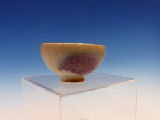 A CHINESE JUN GLAZED BOWL, THE INTERIOR AND EXTERIOR EACH WITH TWO PURPLE SPLASHES. Dia. 8cms.