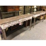 PENNY SUTHERLAND, A PAIR OF GREY FAUX MARBLE PAINTED CONSOLE TABLES, THE APRONS APPLIED WITH SCALLOP
