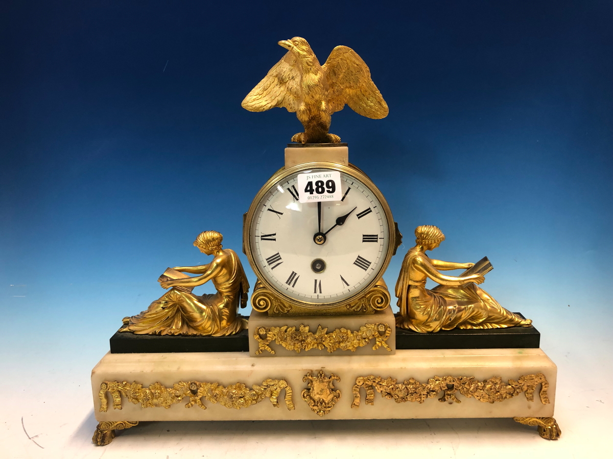 AN ORMOLU AND WHITE MARBLE TIMEPIECE BY JAPY FRERES, THE ENAMEL DIAL SURMOUNTED BY AN EAGLE AND