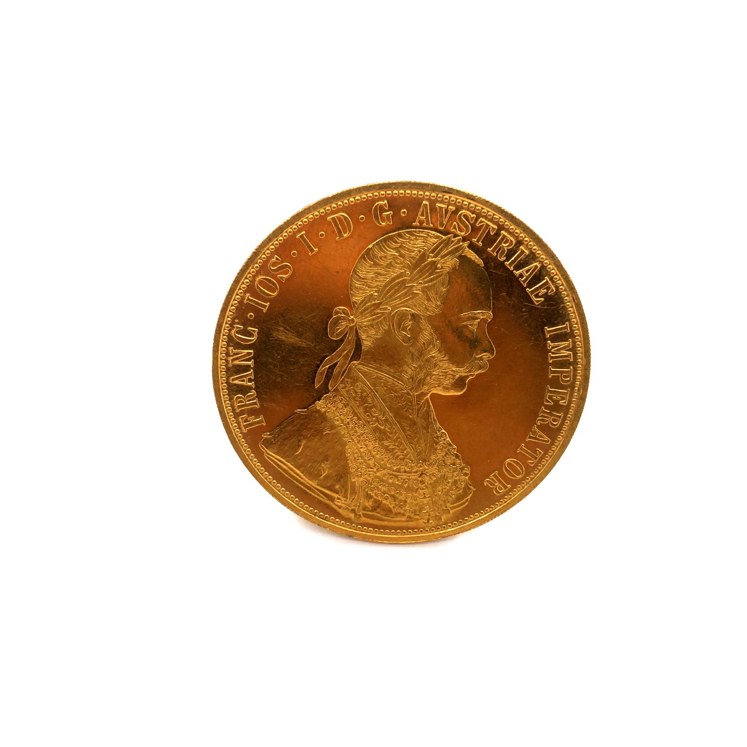A 23ct GOLD 1915 AUSTRIAN MINT FOUR DUCAT COIN FEATURING FRANZ JOSEPH I ON THE OBVERSE AND THE