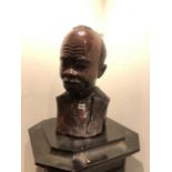 A PAIR OF AFRICAN HARDWOOD BUSTS OF A MAN AND A WOMAN WEARING EARRINGS AND A NECKLACE. H 54cms.