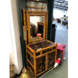 AN EDWARDIAN ORIENTAL LACQUER AND BAMBOO RECTANGULAR MIRROR BACKED STAND, A DRAWER OVER TWO BLACK