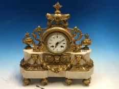 A FRENCH ORMOLU AND WHITE MARBLE CASED CLOCK WITH SWAGS BELOW THE ENAMEL DIAL AND URNS WITH FLAMBEAU