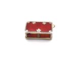 A FRENCH SILVER RED ENAMEL AND GILDED TREASURE CHEST PILL BOX FOB. MEASUREMENTS W 2.3 X L 1.5cms.