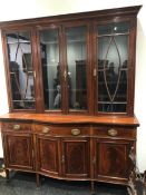 A LATE VICTORIAN MAHOGANY DISPLAY CABINET, THE FOUR DOORS GLAZED WITHIN ROSEWOOD BANDING AND