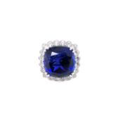 AN IMPRESSIVE LARGE TANZANITE AND DIAMOND COCKTAIL RING. UNHALLMARKED AND STAMPED 750, ASSESSED AS