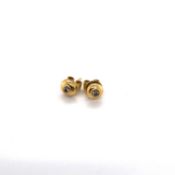 A PAIR OF DIAMOND SOLITAIRE SET EAR STUDS. STAMPED 750 AND ASSESSED AS 18CT GOLD. WEIGHT 2grms.