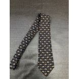 A HERMES TURTLE PRINT SILK NECKTIE.