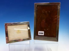 TWO HALLMARKED SILVER PHOTO FRAMES THE LARGER 13.5cm X 20.5cm BRIMINGHAM 1926. THE SMALLER FRAME