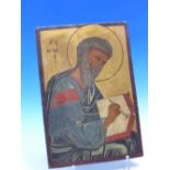 AN ICON PAINTED WITH AN EVANGELIST SEATED WRITING IN A BOOK THE LETTERS B I, THE GOLD GROUND ABOVE