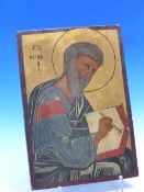 AN ICON PAINTED WITH AN EVANGELIST SEATED WRITING IN A BOOK THE LETTERS B I, THE GOLD GROUND ABOVE