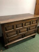 AN 18th C. OAK COFFER WITH NINE PANELLED FRONT . W 126 x D 62 x H 93cms.