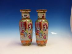 A PAIR OF 19th C. CANTON VASES PAINTED WITH GARDEN AND FIGURE RESERVES BELOW BATS FLANKED BY