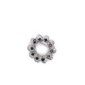 A SAPPHIRE AND DIAMOND FLUTED WREATH BROOCH. THE BROOCH SET WITH TEN ROUND BRILLIANT SAPPHIRES IN