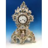 A PORCELAIN CASED BREGUET CLOCK STRIKING ON A BELL, THE ROCAILLE TOPPED CASE ENCRUSTED WITH FLOWERS,