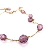 A VINTAGE PASTE FACET BEADED NECKLACE ON A 9ct STAMPED CHAIN, TOGETHER WITH A PAIR OF PINK PASTE