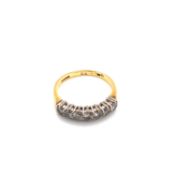 AN 18ct HALLMARKED YELLOW GOLD SEVEN STONE DIAMOND HALF ETERNITY RING. APPROX DIAMOND WEIGH 0.75cts.