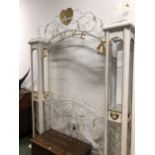 A WHITE AND GILT METAL GARDEN BOWER GATE, THE ARCH INSCRIBED LOVE SUPPORTED ON COLUMNS DECORATED