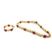 A CABOCHON RUBY AND ROUND BRILLIANT CUT DIAMOND LINE BRACELET AND MATCHING RING. THE BRACELET