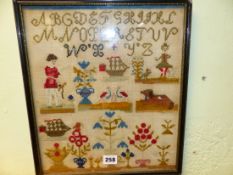 A WOOL SAMPLER WORKED WITH THE ALPHABET ABOVE FIGURES, BIRDS, FLOWERS, A DOG AND SCHOONERS, THE