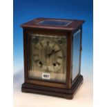 A GLAZED MAHOGANY CASED WINTERHALDER AND HOFMEIER CLOCK CHIMING ON COILED RODS, THE SILVERED DIAL