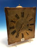 AN ARTS AND CRAFTS SHELF CLOCK STRIKING ON A BELL, THE WEIGHT DRIVEN MOVEMENT WITH A SQUARE BRASS